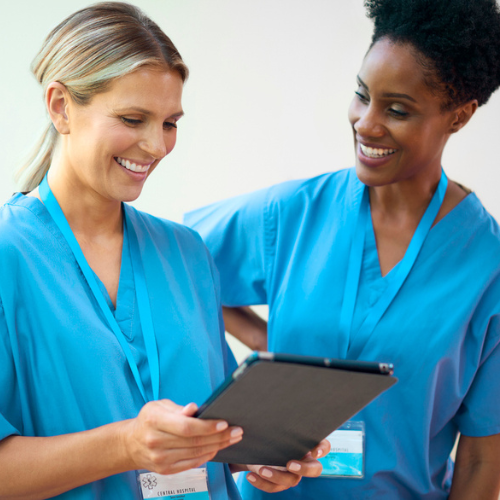 Female medical interns walk to class together stock photo