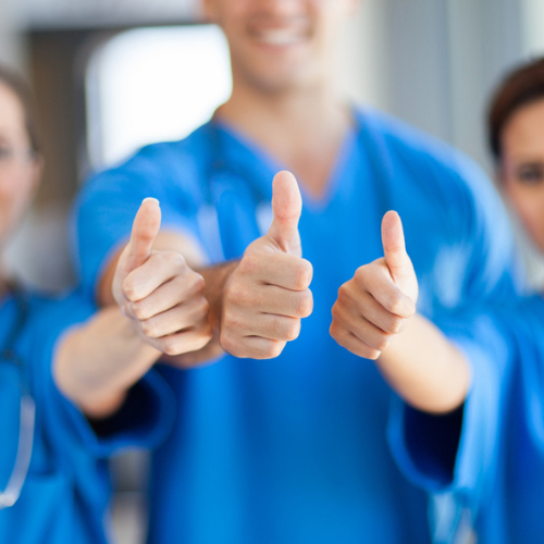 Healthcare workers thumbs up